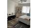 A comfortable bedroom with a vintage cabinet and ceiling fan at 4743 W Alice Ave, Glendale, AZ 85302