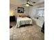 Bedroom with neutral bedding, ceiling fan, and a built-in windowsill at 4743 W Alice Ave, Glendale, AZ 85302