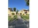 Exterior shot of the property featuring lush landscaping and a well-maintained walkway at 4743 W Alice Ave, Glendale, AZ 85302