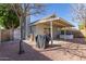 Cozy backyard featuring a covered patio and relaxing hot tub, perfect for outdoor living at 5210 W Jupiter N Way, Chandler, AZ 85226