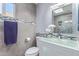 Modern bathroom features custom glass countertop, tile accents, and a stylish mirror, next to toilet at 5210 W Jupiter N Way, Chandler, AZ 85226