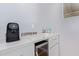 Modern coffee bar featuring light colored cabinets and a wine refrigerator at 5210 W Jupiter N Way, Chandler, AZ 85226