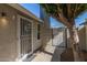 Charming entryway with secure screen door and 'Welcome' wreath, adding a personal touch at 5210 W Jupiter N Way, Chandler, AZ 85226