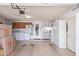 Spacious garage interior features lots of storage cabinets, washer, dryer, utility sink, and ample room for parking at 5210 W Jupiter N Way, Chandler, AZ 85226