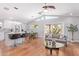 Bright open living space featuring hardwood floors, vaulted ceiling, and a sliding glass door at 5210 W Jupiter N Way, Chandler, AZ 85226