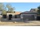 Charming single-story home featuring a two-car garage and low maintenance desert landscaping at 5403 W Novak Way, Laveen, AZ 85339