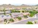 View of desert home with a tile roof, desert landscaping, a paved driveway, and mountain views at 5542 W Big Oak St, Phoenix, AZ 85083