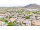 Panoramic view of a beautiful neighborhood with well-maintained homes, lush landscaping, and mountain backdrop at 5542 W Big Oak St, Phoenix, AZ 85083