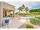 Entertainer's backyard with built-in BBQ, covered patio, and refreshing pool with lush landscaping at 5542 W Big Oak St, Phoenix, AZ 85083