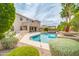 Backyard oasis with pool, covered patio, lush landscaping, and pergola with spa at 5542 W Big Oak St, Phoenix, AZ 85083