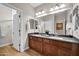Modern bathroom featuring a double vanity, gray counters, stylish lighting, and a separate toilet and shower at 5542 W Big Oak St, Phoenix, AZ 85083