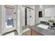 Bathroom showcases a modern glass shower door, gray counter, and a convenient door to the private patio at 5542 W Big Oak St, Phoenix, AZ 85083