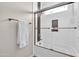 Bright bathroom showcasing a bathtub with glass doors, bronze fixtures, and white subway tile surround at 5542 W Big Oak St, Phoenix, AZ 85083