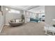 Spacious bedroom with sitting area, home gym, and plantation shutters at 5542 W Big Oak St, Phoenix, AZ 85083