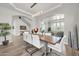 Formal dining area with seating for ten, set beneath decorative recessed lighting, and stairs in the background at 5542 W Big Oak St, Phoenix, AZ 85083
