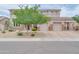 Stunning two-story home boasting a three-car garage, well-maintained landscaping, and stone detailing at 5542 W Big Oak St, Phoenix, AZ 85083
