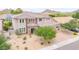 Stunning two-story home with a tile roof, desert landscaping, and stone facade accents at 5542 W Big Oak St, Phoenix, AZ 85083