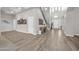 Stunning entryway boasting soaring ceilings, staircase, and sleek wood-look tile floors at 5542 W Big Oak St, Phoenix, AZ 85083