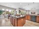 Spacious kitchen featuring wood cabinets, double islands, and modern appliances at 5542 W Big Oak St, Phoenix, AZ 85083