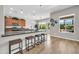 Bright kitchen with a large island, bar seating, stainless steel appliances, and backyard views at 5542 W Big Oak St, Phoenix, AZ 85083