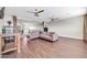 Expansive living room with hardwood floors, multiple ceiling fans, and an open layout for versatile arrangement at 5542 W Big Oak St, Phoenix, AZ 85083