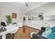 Comfortable home office features wood floors, ample storage, and a stylish sofa for relaxation or creative brainstorming at 5542 W Big Oak St, Phoenix, AZ 85083