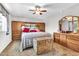 Bedroom featuring carpet flooring, built-in storage, and vintage furniture at 6055 E Hannibal St, Mesa, AZ 85205