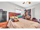 Bedroom with a mini-fridge and closet storage at 6055 E Hannibal St, Mesa, AZ 85205
