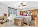 Bedroom with carpet, a ceiling fan, window, and vintage furniture at 6055 E Hannibal St, Mesa, AZ 85205