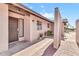 Single-story home featuring arched entry, security door, and desert landscaping at 6055 E Hannibal St, Mesa, AZ 85205