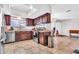 Functional kitchen boasts stainless steel appliances and generous counter space with tile flooring at 6055 E Hannibal St, Mesa, AZ 85205