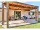 Covered patio with ample seating, perfect for outdoor relaxation and entertaining guests at 6055 E Hannibal St, Mesa, AZ 85205
