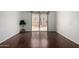 Bedroom featuring hardwood floors, neutral paint, and sliding doors to the patio at 611 E Colgate Dr, Tempe, AZ 85283