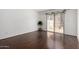 Bedroom featuring hardwood floors, neutral paint, and sliding doors to the patio at 611 E Colgate Dr, Tempe, AZ 85283