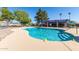 Inviting community pool with pristine blue water and ample lounge seating at 611 E Colgate Dr, Tempe, AZ 85283