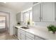 Bright kitchen featuring quartz countertops, modern fixtures, and plenty of natural light at 611 E Colgate Dr, Tempe, AZ 85283