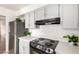 Well-maintained kitchen features ample counter space, modern appliances, and white cabinetry at 611 E Colgate Dr, Tempe, AZ 85283