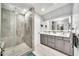 Elegant bathroom with a glass-enclosed shower and double sink vanity at 6215 E Surrey Ave, Scottsdale, AZ 85254