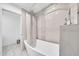Bright bathroom showcasing a soaking tub with a shower, stylish tile, and a modern vanity at 6215 E Surrey Ave, Scottsdale, AZ 85254