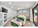 Bright bedroom boasts a plush bed, a modern ceiling fan, and ample natural light at 6215 E Surrey Ave, Scottsdale, AZ 85254