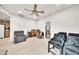 Spacious bonus room with tile floors, a ceiling fan, and versatile seating arrangements at 6215 E Surrey Ave, Scottsdale, AZ 85254