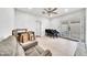 Open bonus room with tile flooring, a ceiling fan, and comfortable seating arrangement at 6215 E Surrey Ave, Scottsdale, AZ 85254