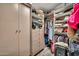 Spacious closet with ample shelving, drawers, and hanging space for organized storage at 6215 E Surrey Ave, Scottsdale, AZ 85254