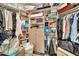Organized closet with shelving, drawers, and hanging space for optimal storage solutions at 6215 E Surrey Ave, Scottsdale, AZ 85254