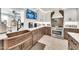 Well-equipped kitchen showcasing custom cabinetry, a copper sink, tile backsplash, and modern appliances at 6215 E Surrey Ave, Scottsdale, AZ 85254