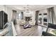 Living room with a modern fireplace and two white chairs at 6215 E Surrey Ave, Scottsdale, AZ 85254