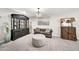Living room featuring a decorative cabinet, gray sofa, and modern decor at 6215 E Surrey Ave, Scottsdale, AZ 85254