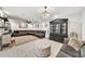 Comfortable living room featuring tile floors, ceiling fan, recessed lighting, plush seating, and stylish decor at 6215 E Surrey Ave, Scottsdale, AZ 85254
