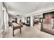 Open-concept space features tile floors, recessed lighting, game table, and seamless transition to dining area and kitchen at 6215 E Surrey Ave, Scottsdale, AZ 85254