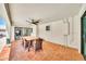 Covered patio features tile flooring, ceiling fan and outdoor dining area at 6215 E Surrey Ave, Scottsdale, AZ 85254